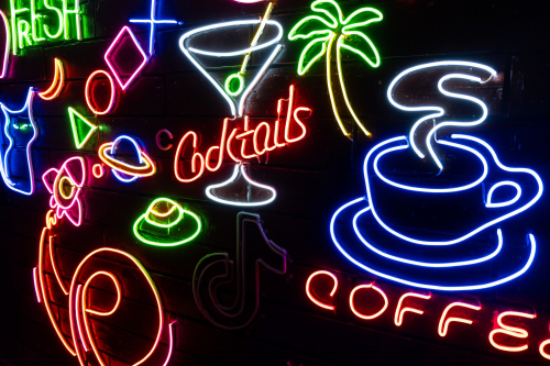 neon-assorted-shapes-black-wall-glowing-multi-colored-neon